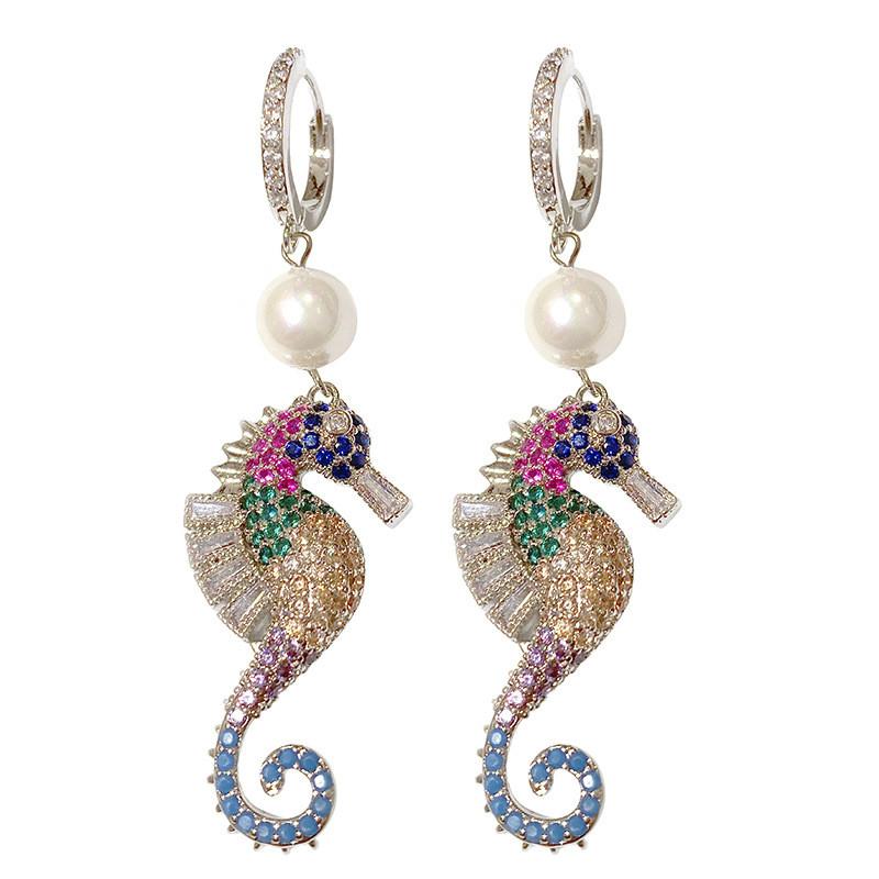 A pair of elegant seahorse earrings featuring cubic zirconia and simulated pearl drops, designed for women.