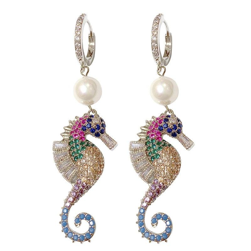 A pair of elegant seahorse earrings featuring cubic zirconia and simulated pearl drops, designed for women.
