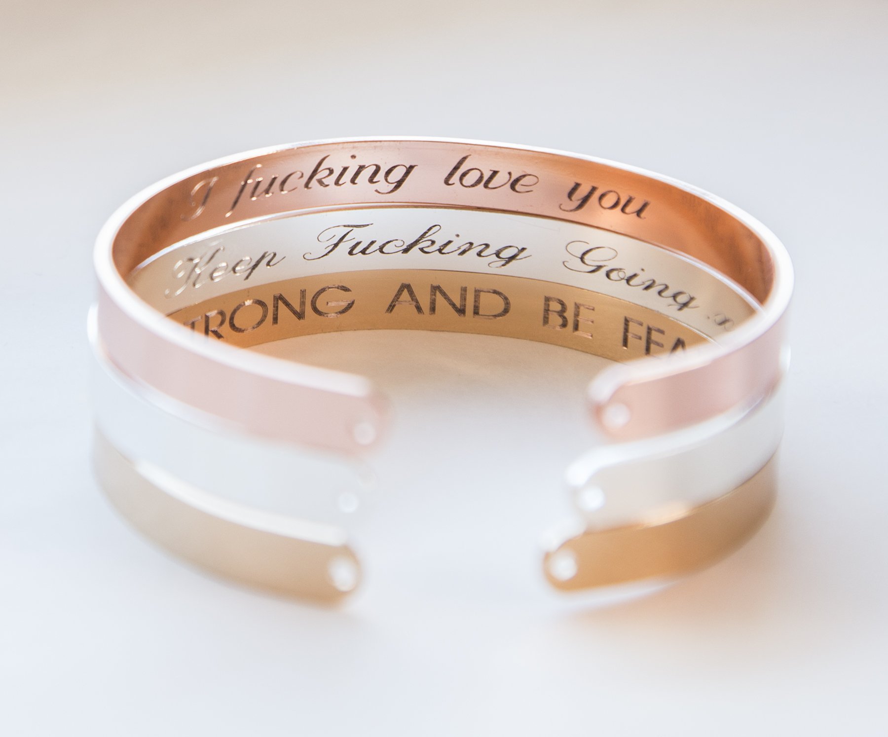 A delicate Secret Message Engraved Bracelet in gold, rose gold, and silver plating, showcasing its adjustable design and personalized engraving options.