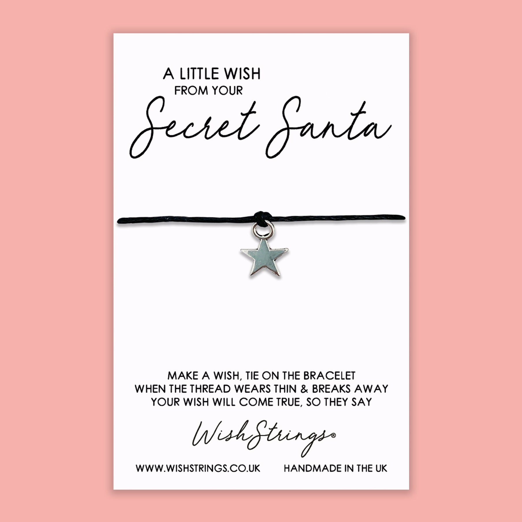 A delicate Secret Santa WishStrings Wish Bracelet featuring a star-shaped charm, displayed on a luxury wish card.