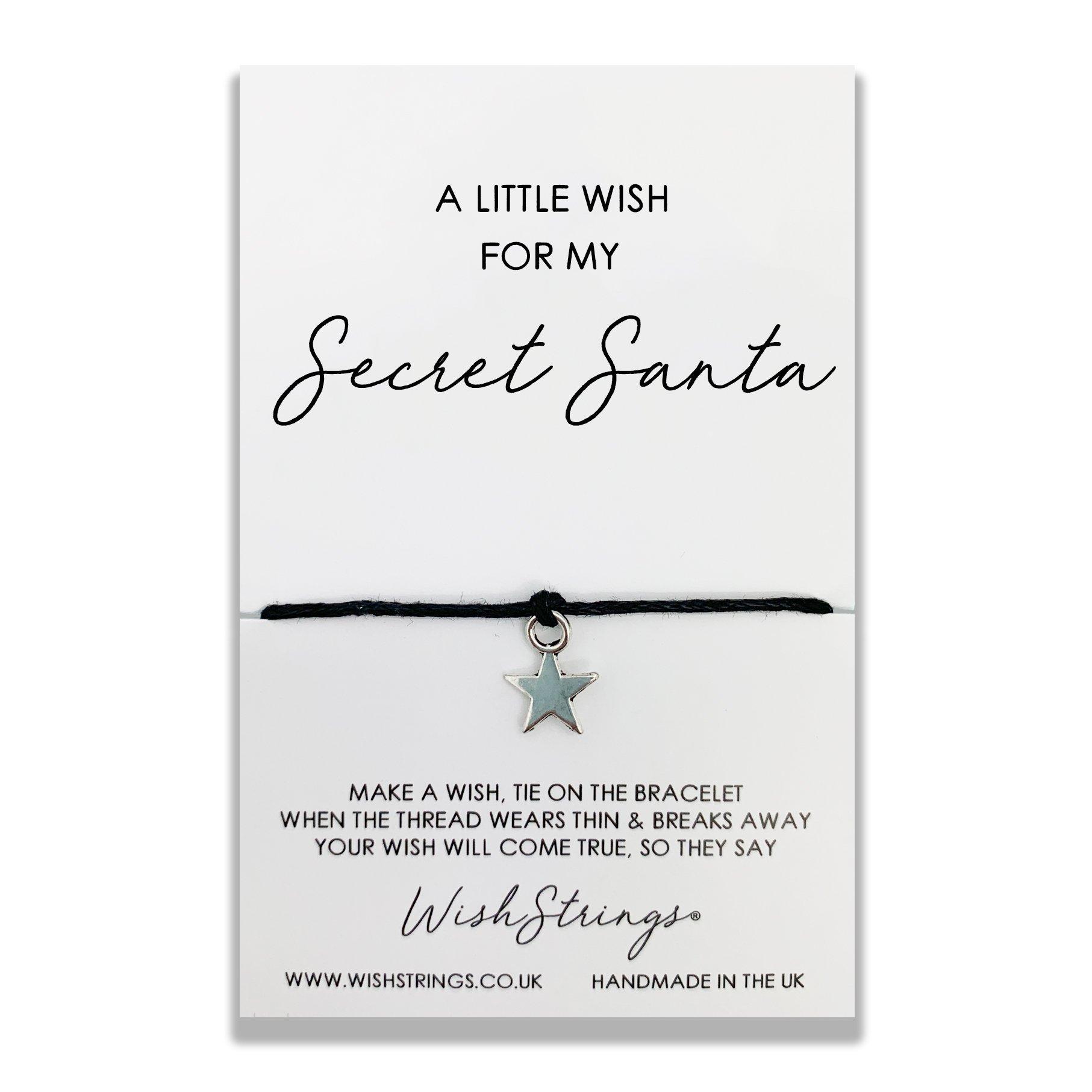 A delicate Secret Santa WishStrings Wish Bracelet featuring a star-shaped charm, displayed on a luxury wish card.