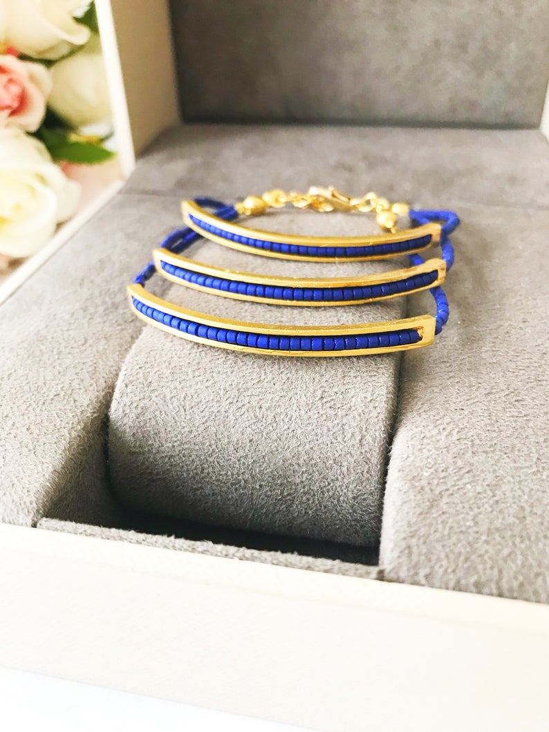 Handmade Seed Beads Bracelet featuring blue Miyuki beads and a delicate gold chain, symbolizing luck and protection.