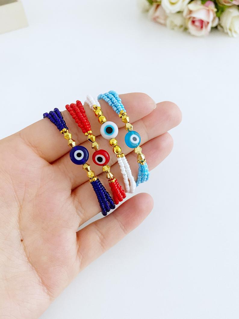 Handmade Seed Beads Evil Eye Bracelet featuring colorful Miyuki beads in blue, red, turquoise, and white.