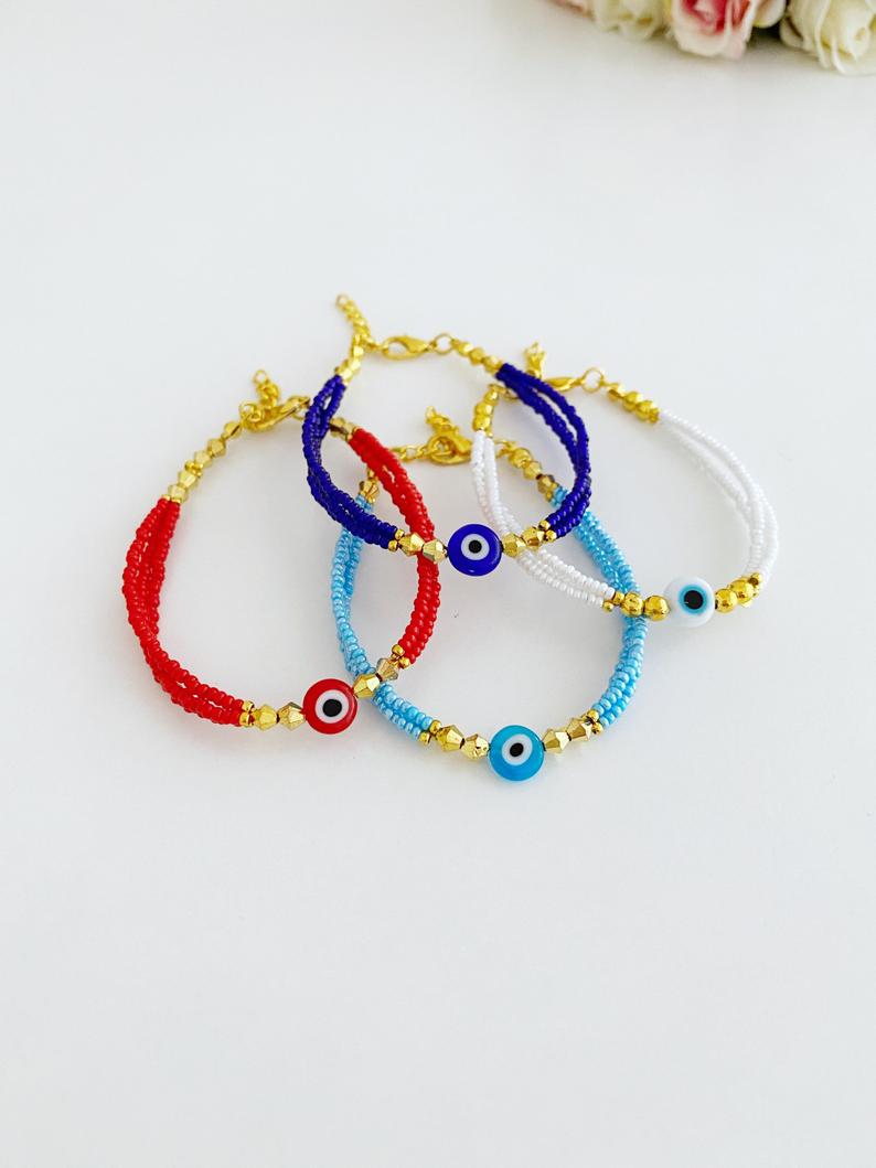 Handmade Seed Beads Evil Eye Bracelet featuring colorful Miyuki beads in blue, red, turquoise, and white.