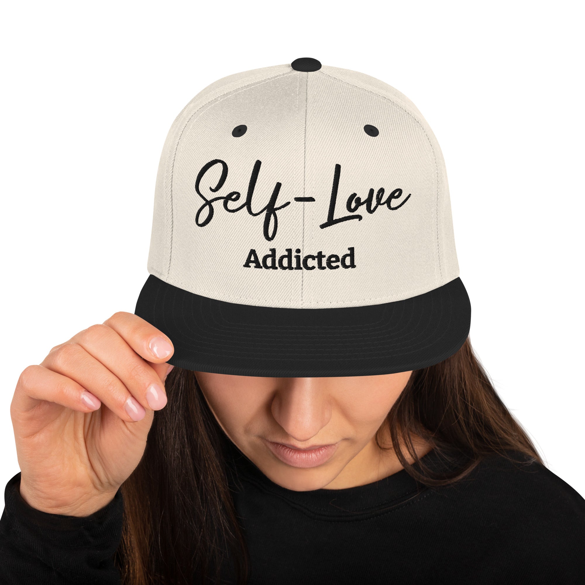 Self Love Addicted Snapback Hat featuring a flat brim, structured design, and adjustable snap closure, perfect for stylish individuals.