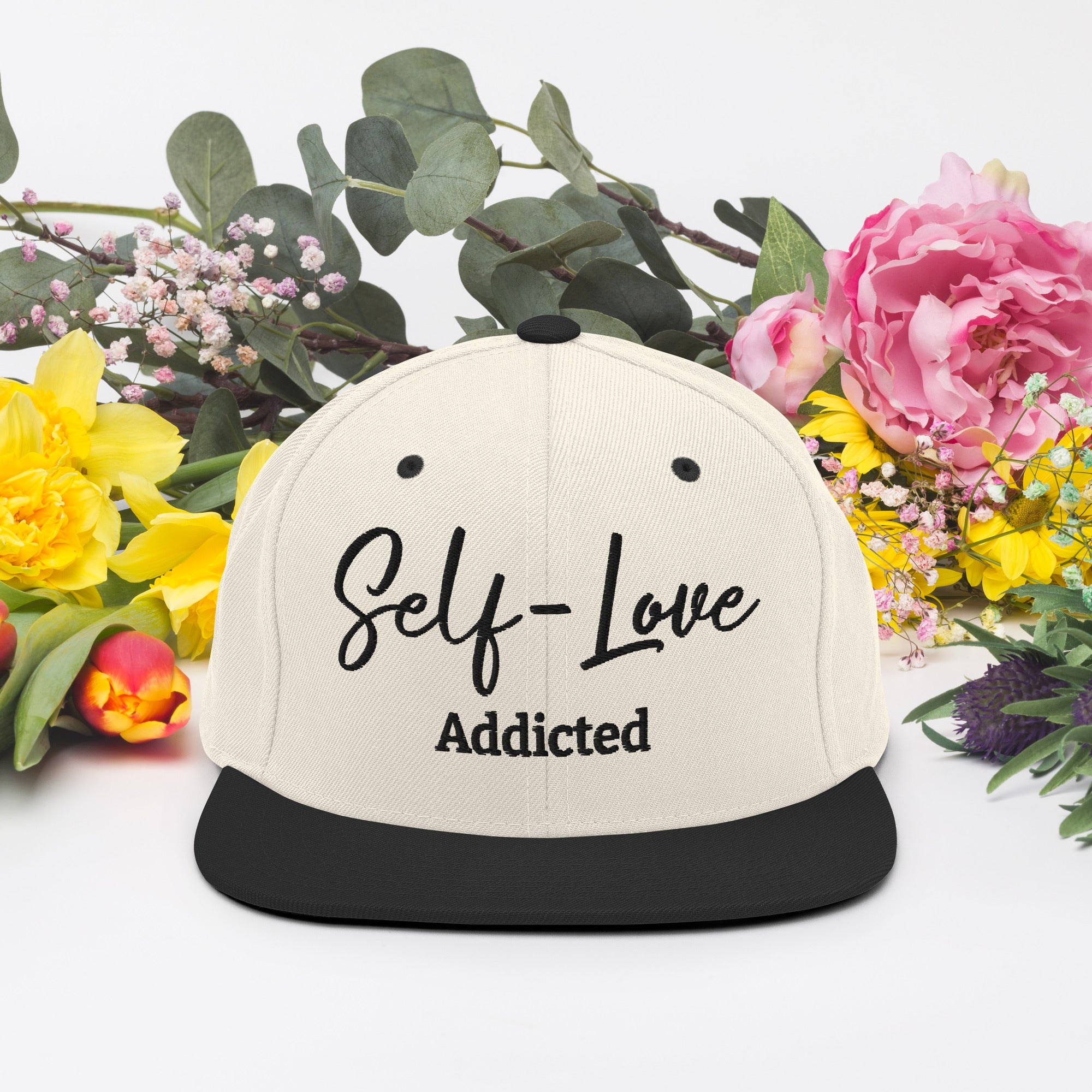 Self Love Addicted Snapback Hat featuring a flat brim, structured design, and adjustable snap closure, perfect for stylish individuals.