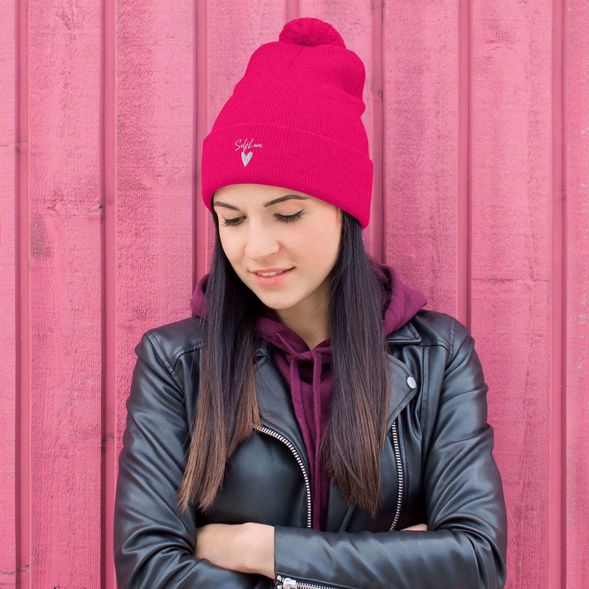 Self Love Pom-Pom Beanie featuring an embroidered design and a fluffy pom-pom on top, perfect for winter wear.