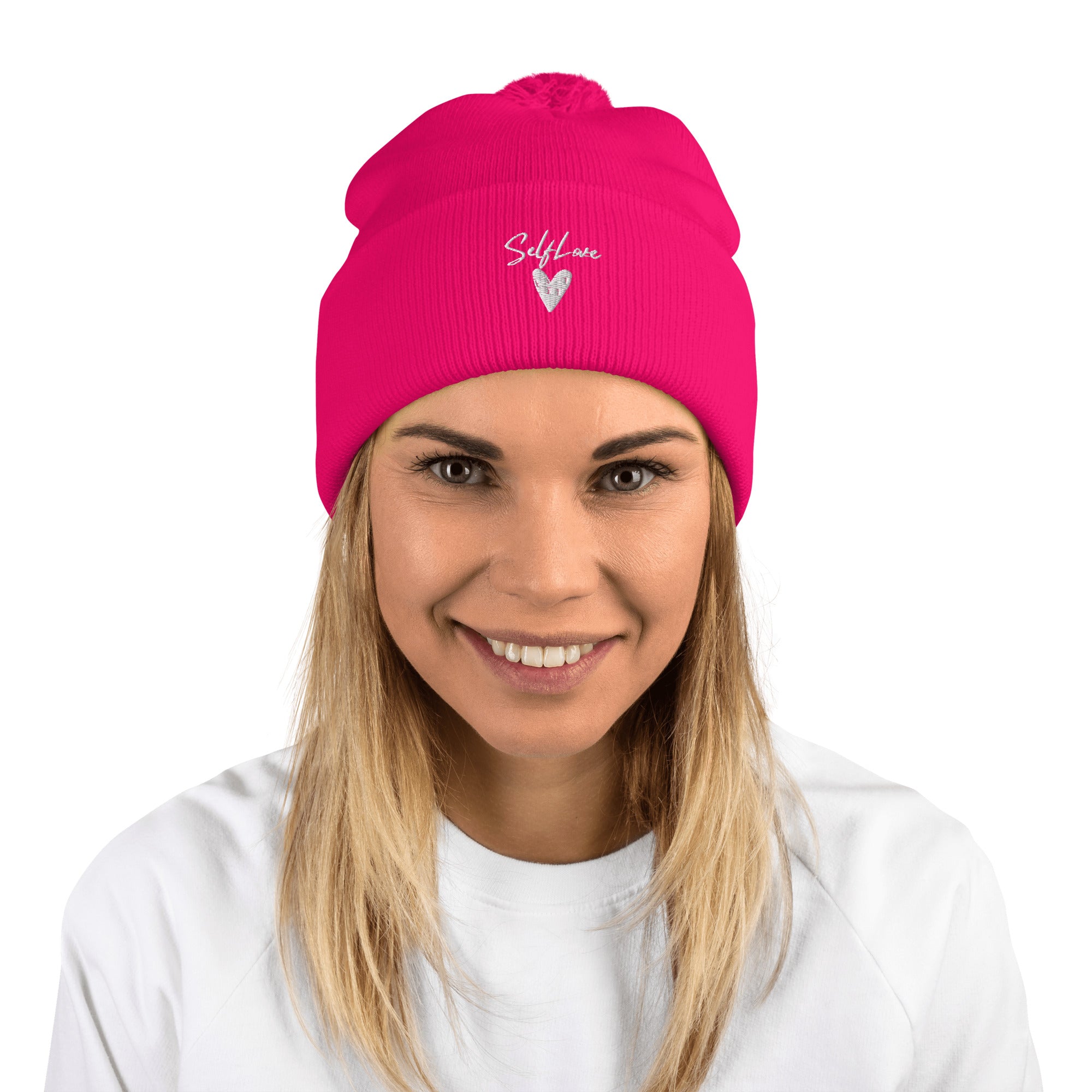 Self Love Pom-Pom Beanie featuring an embroidered design and a fluffy pom-pom on top, perfect for winter wear.