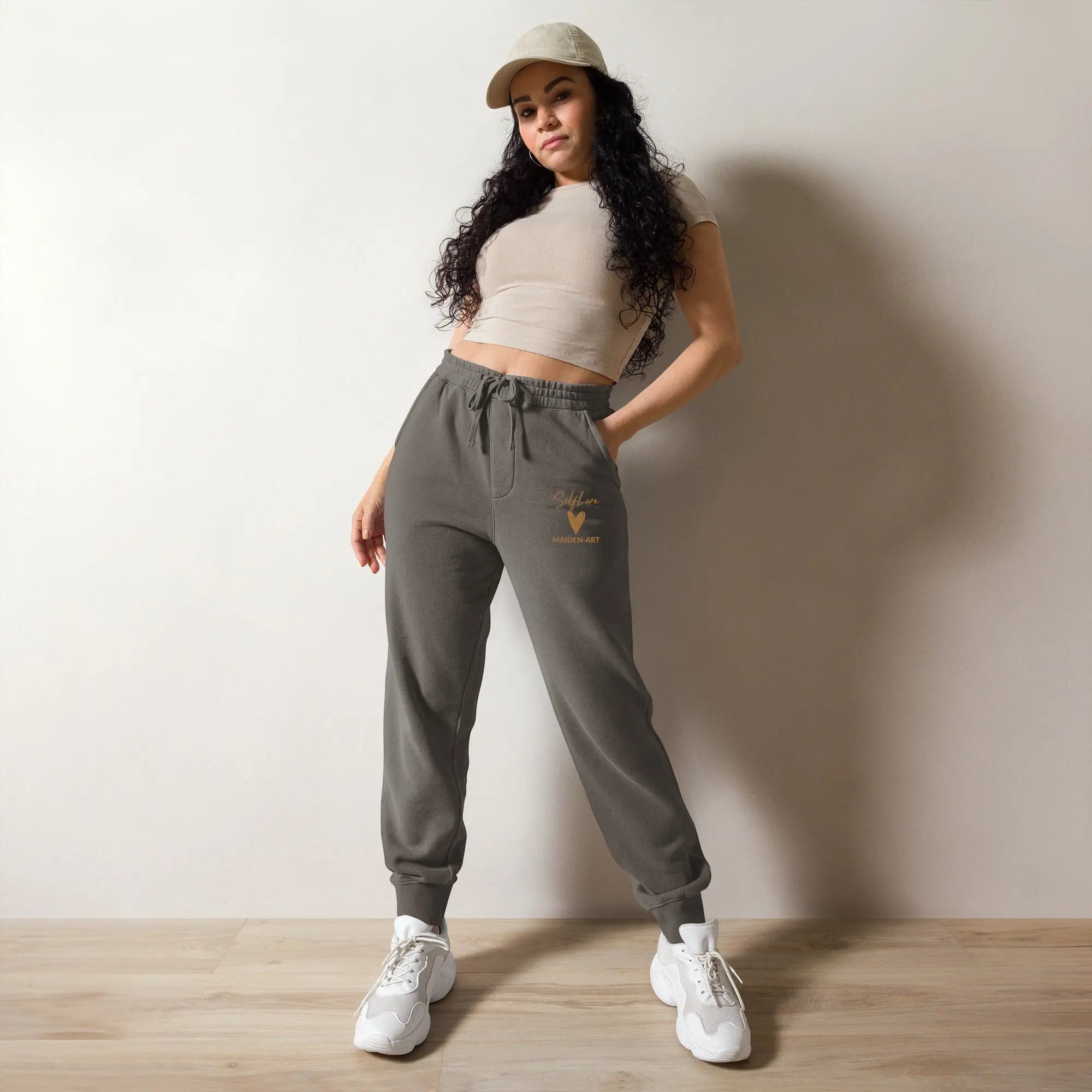 Self Love unisex pigment-dyed sweatpants with Old Gold embroidery, featuring pockets and adjustable drawstrings.