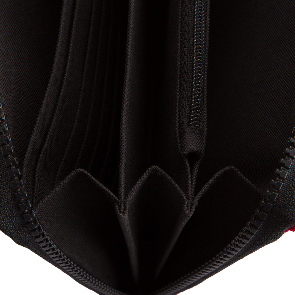 Serra Recycled Rubber Vegan Travel Organiser in apple green, showcasing multiple compartments and a durable zip closure.