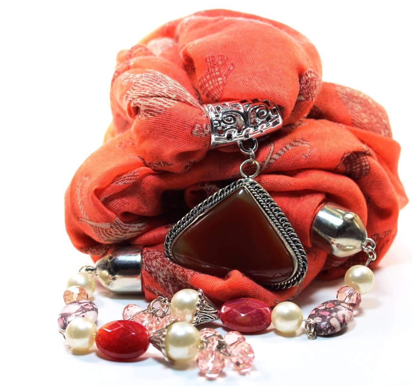 Serengeti Sunset Pendant Scarf featuring vibrant orange chiffon, silver-tone pendant, faux pearls, and pink crystal accents.