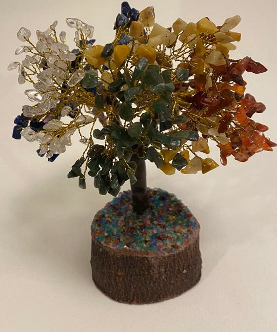A beautifully crafted Seven Chakra Gemstone Tree featuring 500 chips of various healing crystals, symbolizing good luck and prosperity.