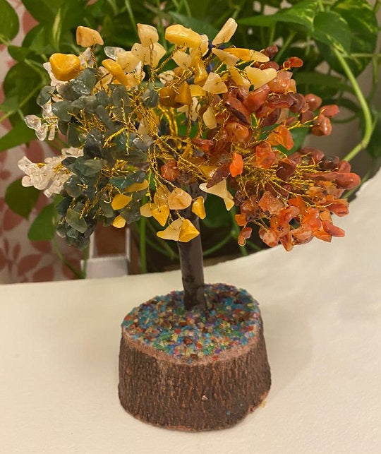 A beautifully crafted Seven Chakra Gemstone Tree featuring 500 chips of various healing crystals, symbolizing good luck and prosperity.