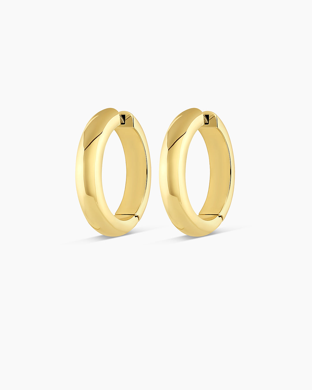 Elegant 14k gold hoop earrings designed for layering and styling.