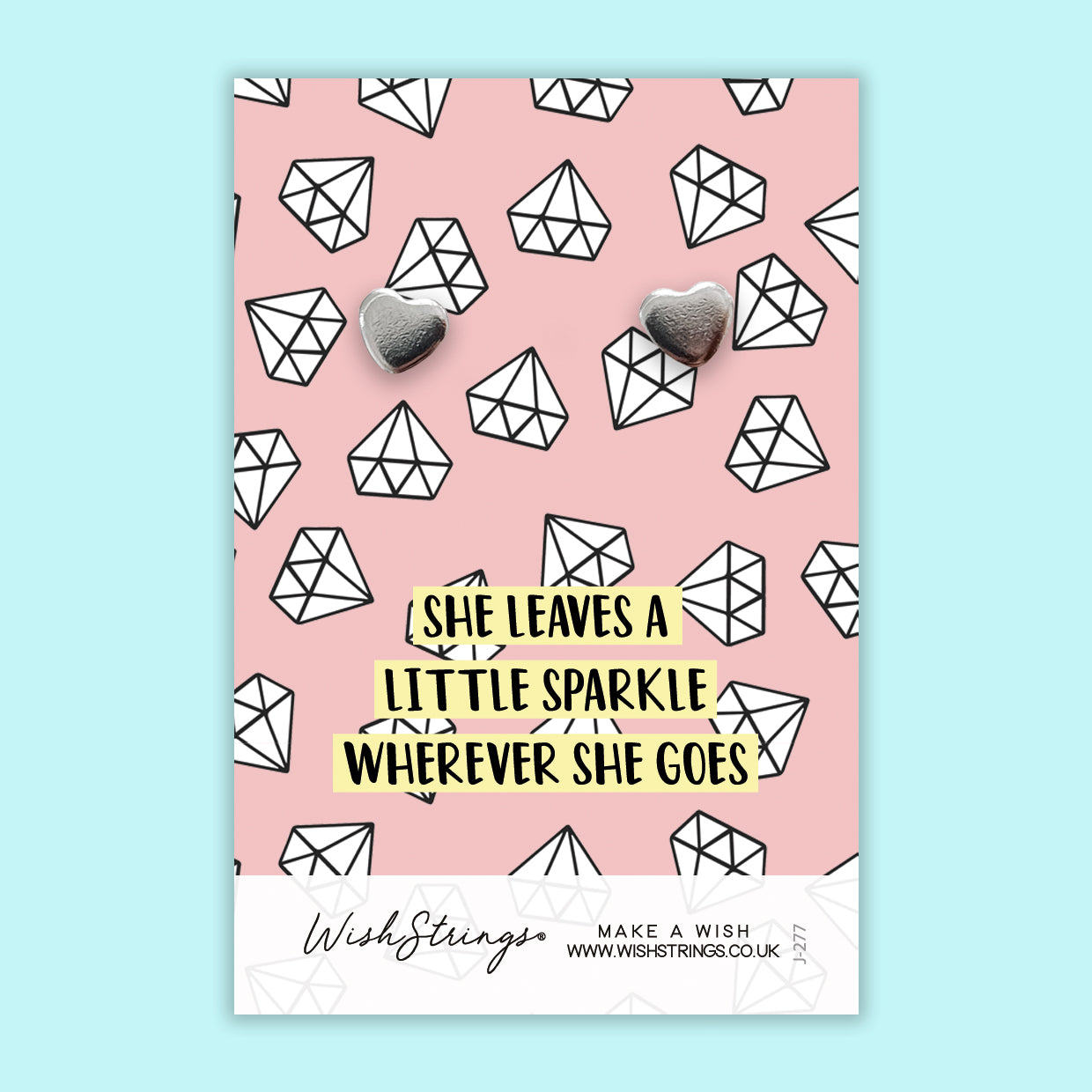 She Sparkles Silver Heart Stud Earrings made from hypoallergenic 304 stainless steel, elegantly displayed on a gift card.