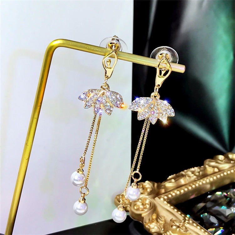 Elegant Shinning Lotus Long Earrings featuring dual pear tassels, crafted from alloy and rhinestones.