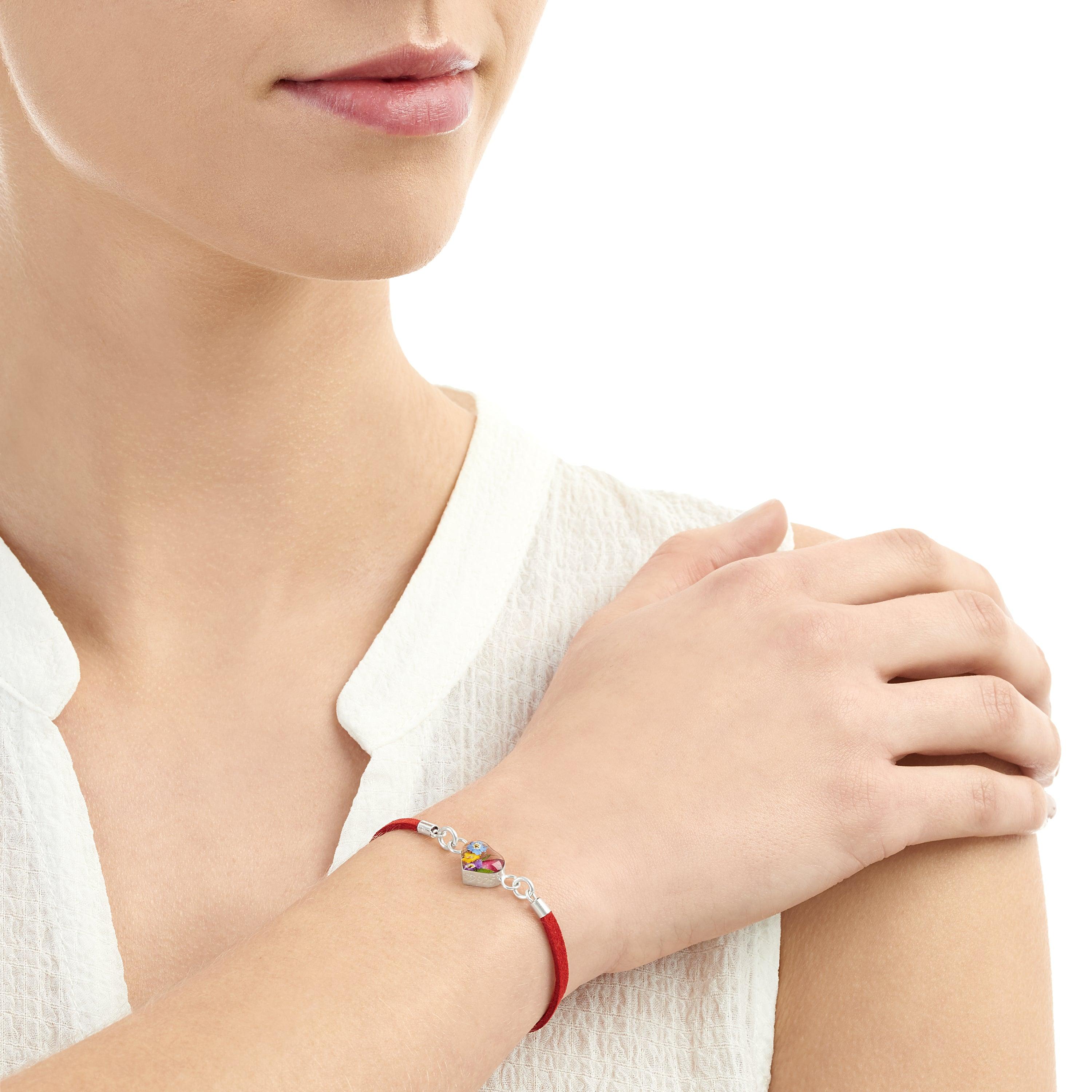 Shrieking Violet Funky Bracelet featuring a pink vegan suede strap and a round charm with a preserved Pink Daisy flower.