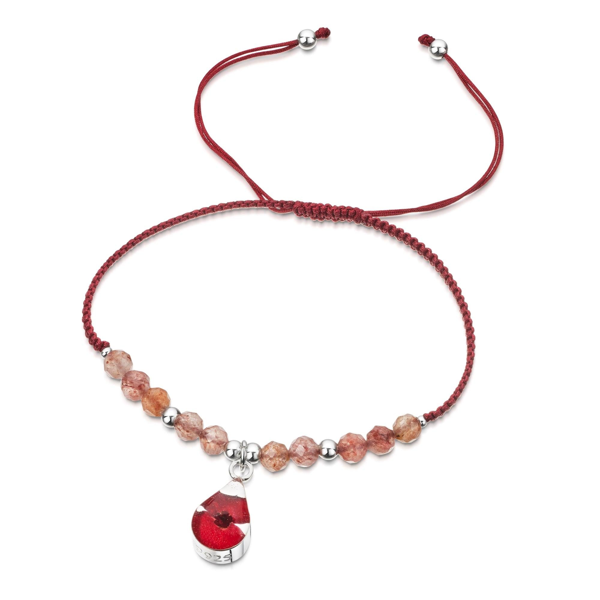 Shrieking Violet Gemstone Poppy Bracelet featuring garnets, silver beads, and a real dried poppy charm on a red nylon strap.