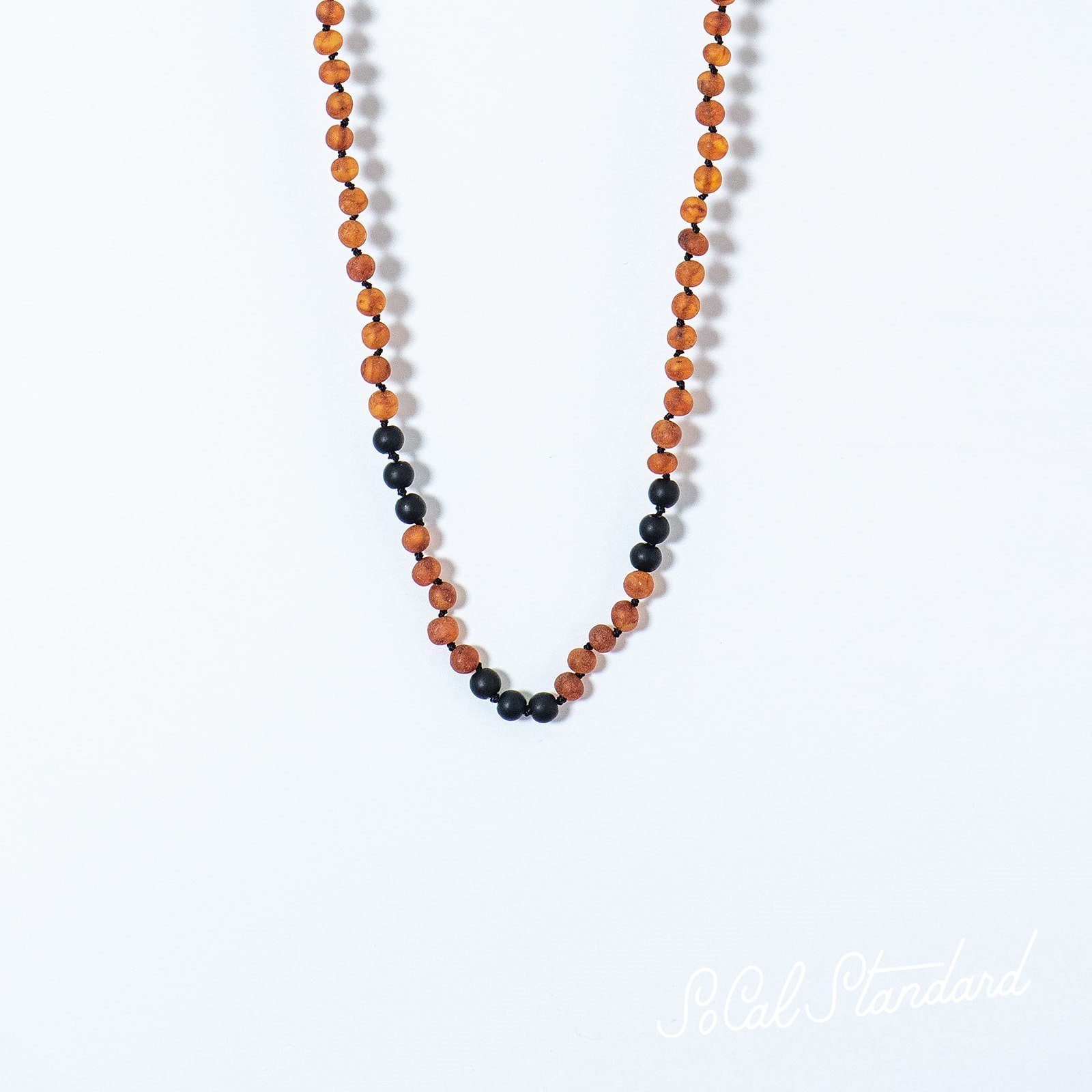 Shungite and Amber necklace designed for adults, featuring raw cognac amber beads and shungite, promoting natural healing and radiation blocking.