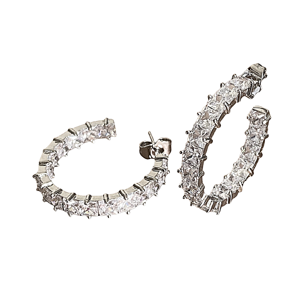 Elegant silver hoop earrings featuring princess cut white diamond cubic zirconia stones, perfect for any occasion.