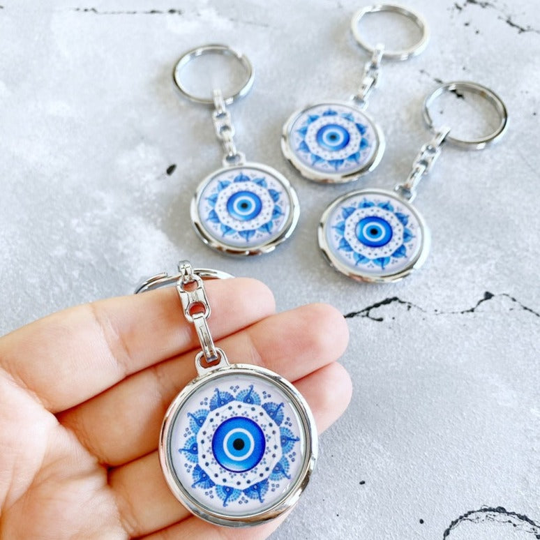 Handmade Silver Keychain featuring a Greek Evil Eye design with blue and white colors, perfect for protection and style.