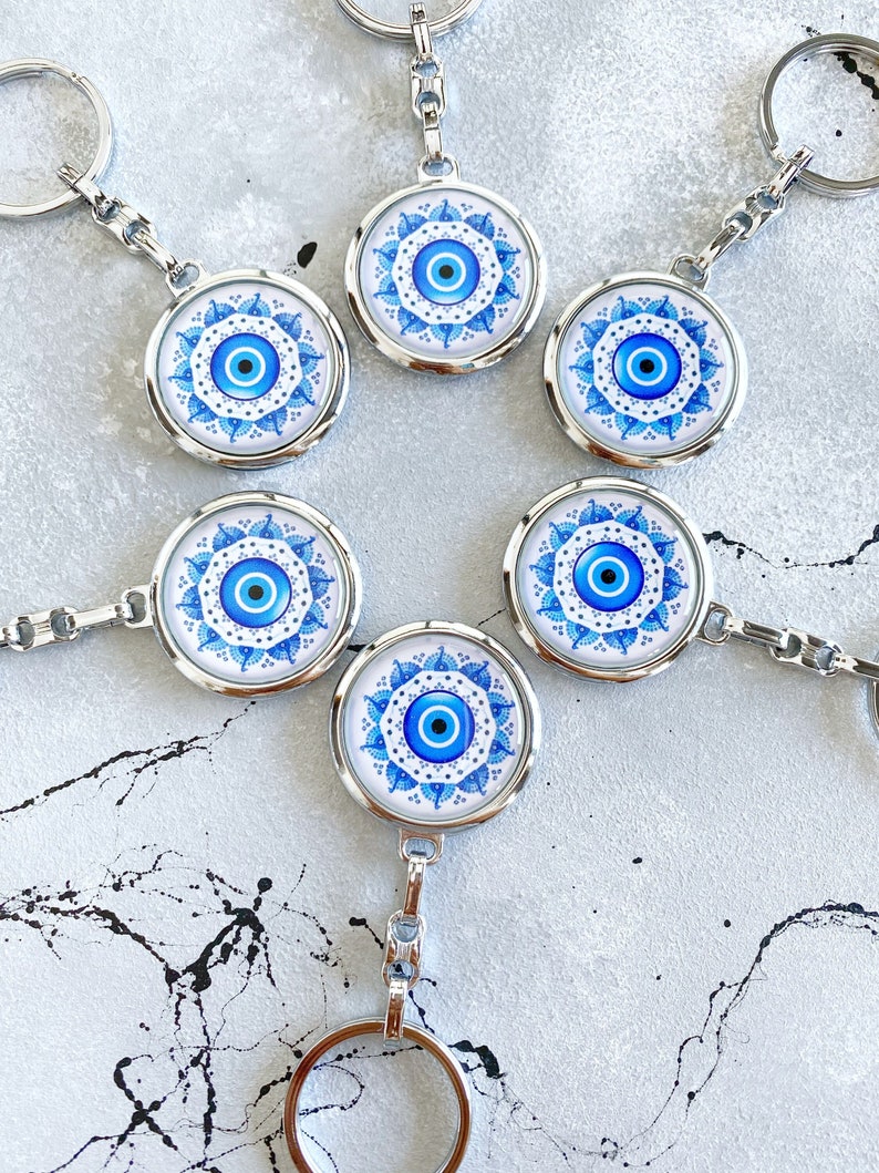 Handmade Silver Keychain featuring a Greek Evil Eye design with blue and white colors, perfect for protection and style.