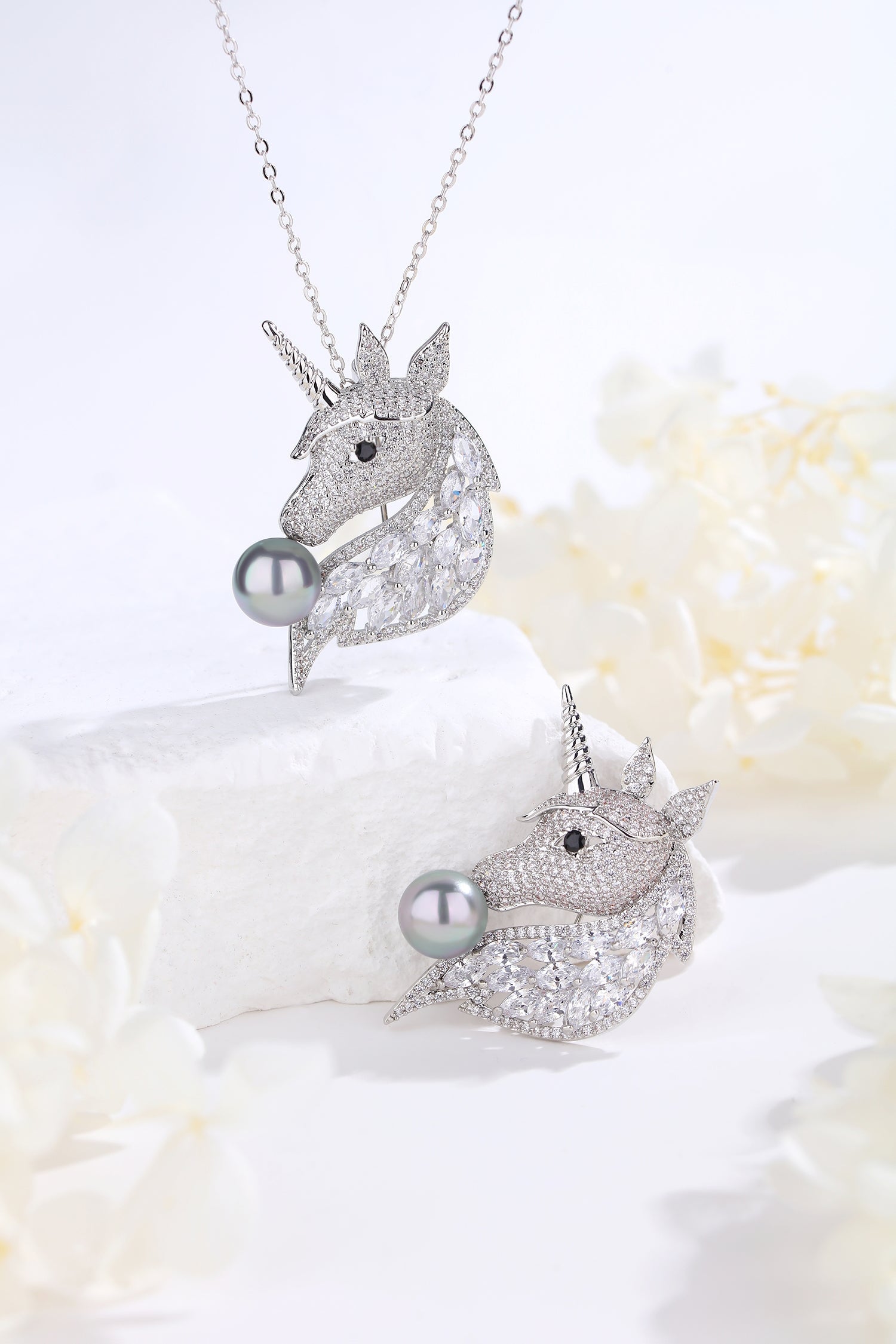 Silver Pavé Unicorn Brooch and Necklace Set featuring Swarovski crystals and a faux Tahitian pearl, showcasing a mythical unicorn design.