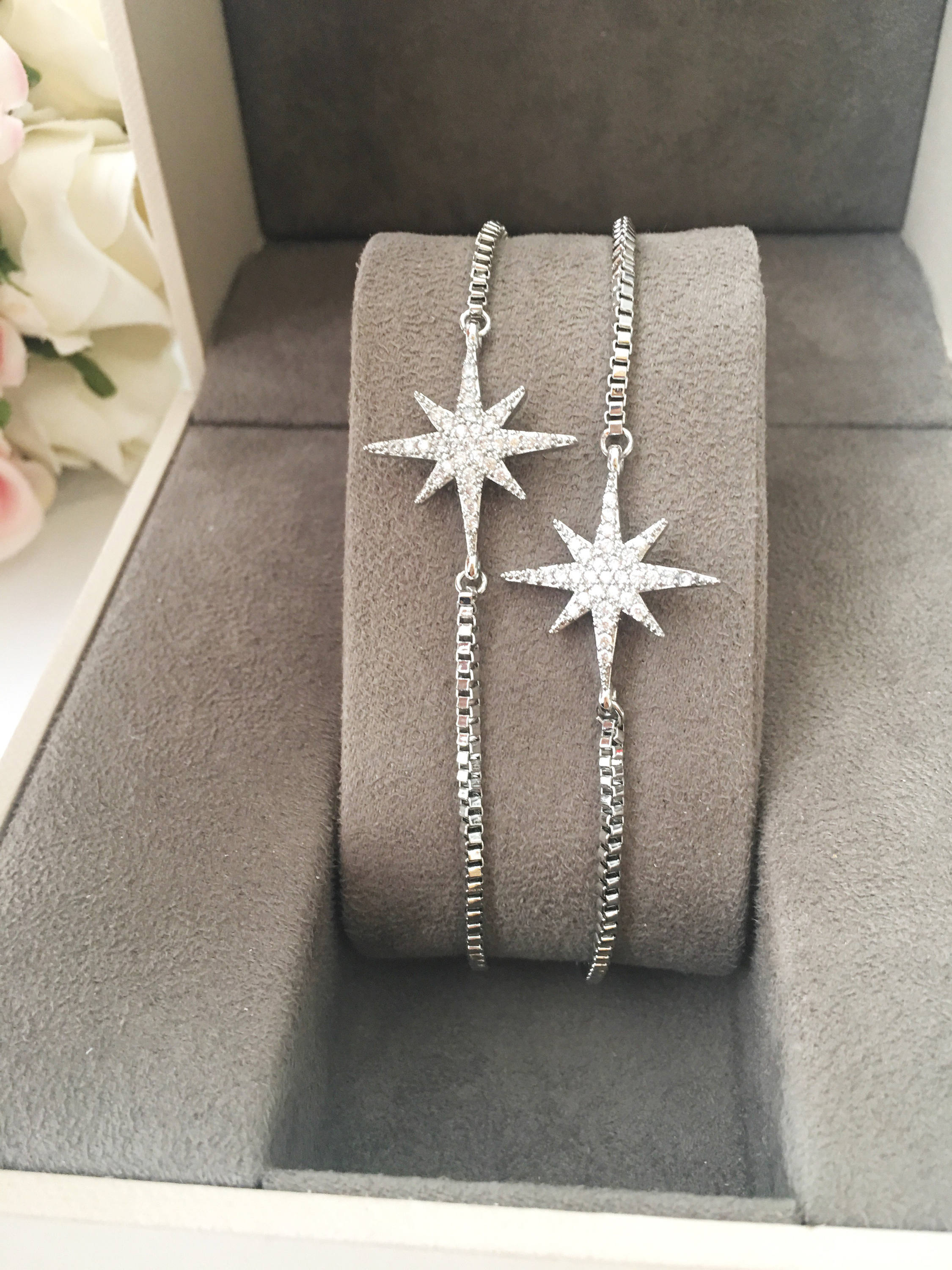 A beautiful handmade silver star bracelet featuring a silver star charm, adjustable design, and tarnish-resistant stainless steel material.