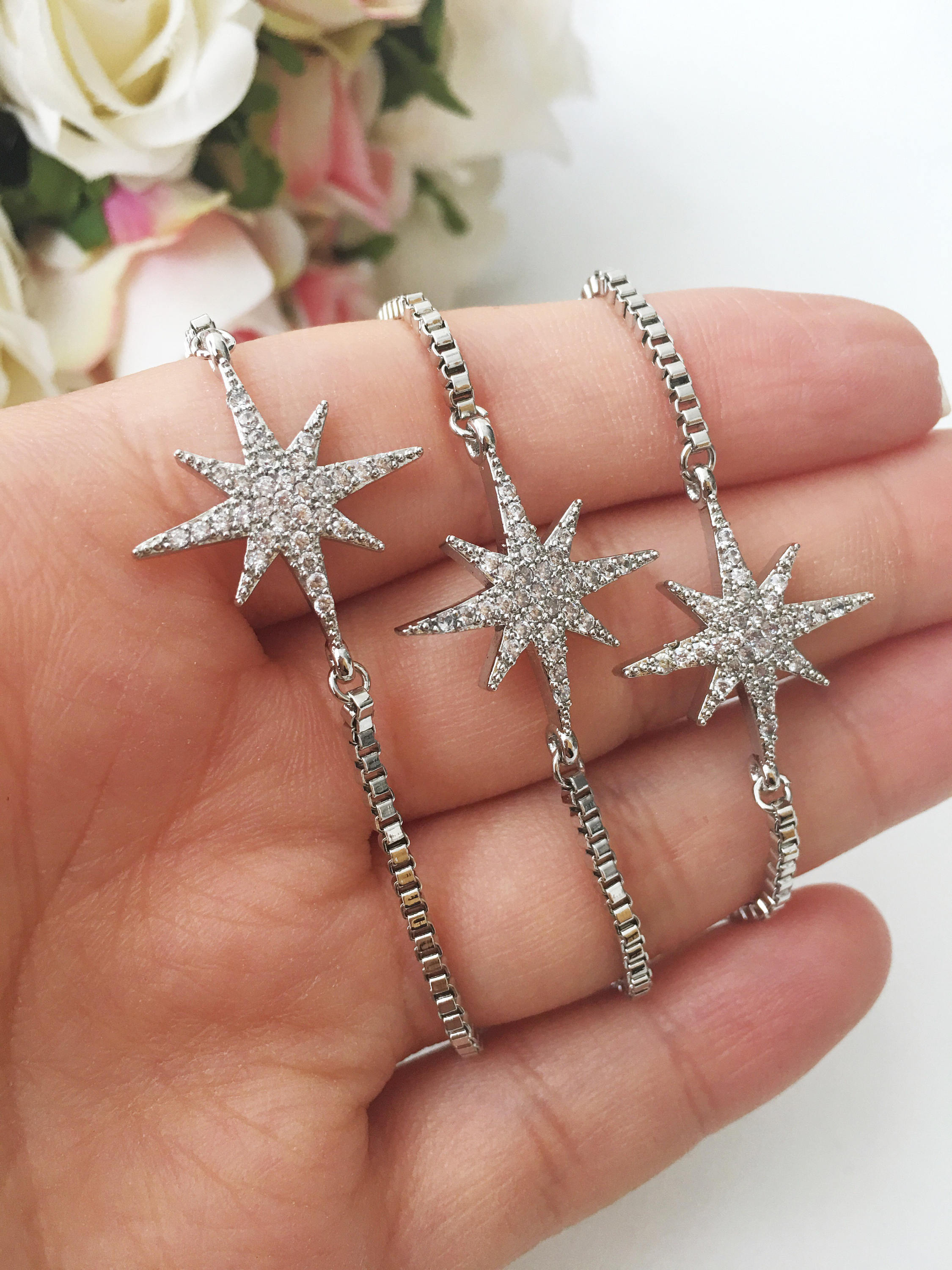 A beautiful handmade silver star bracelet featuring a silver star charm, adjustable design, and tarnish-resistant stainless steel material.