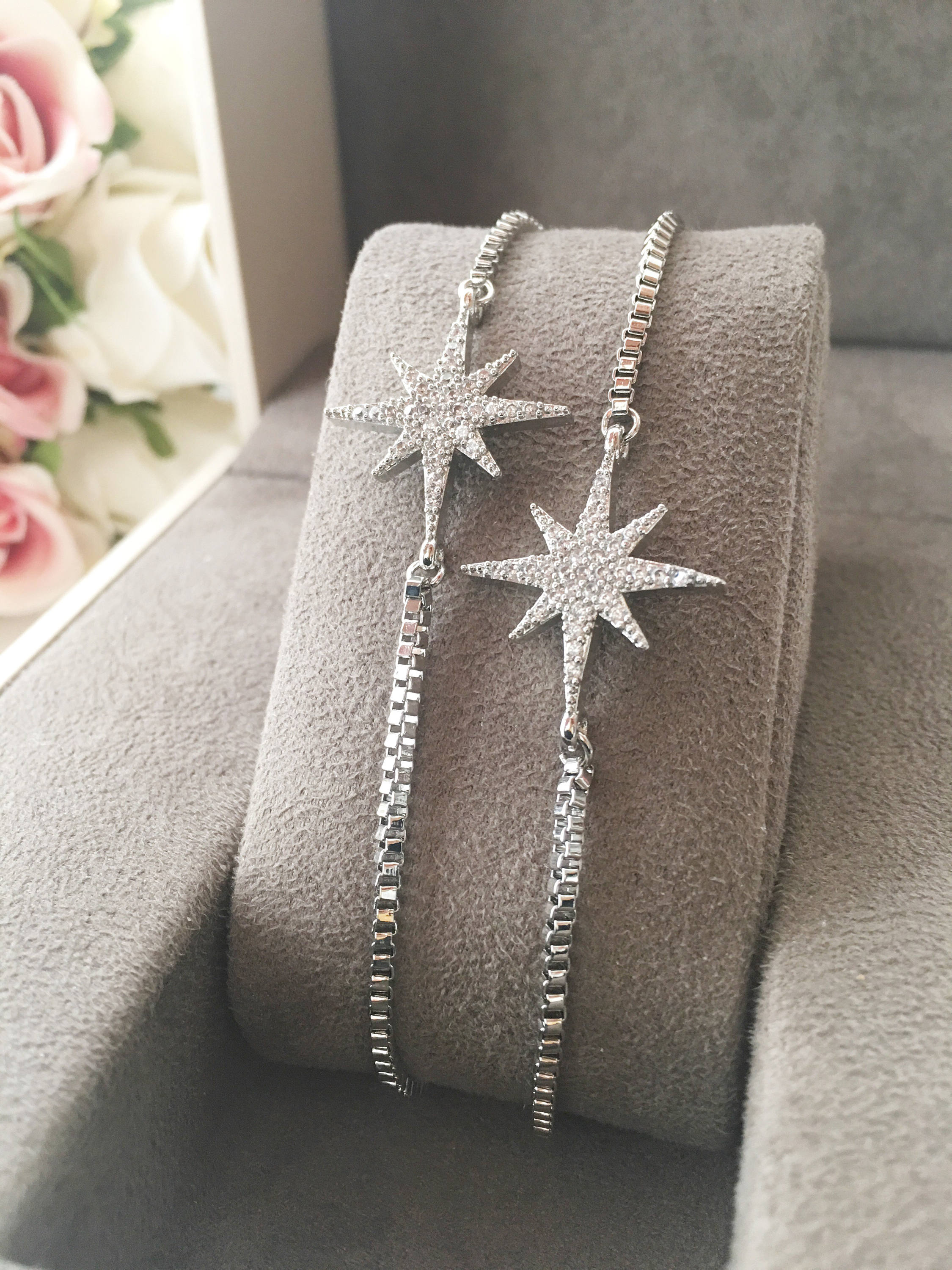 A beautiful handmade silver star bracelet featuring a silver star charm, adjustable design, and tarnish-resistant stainless steel material.