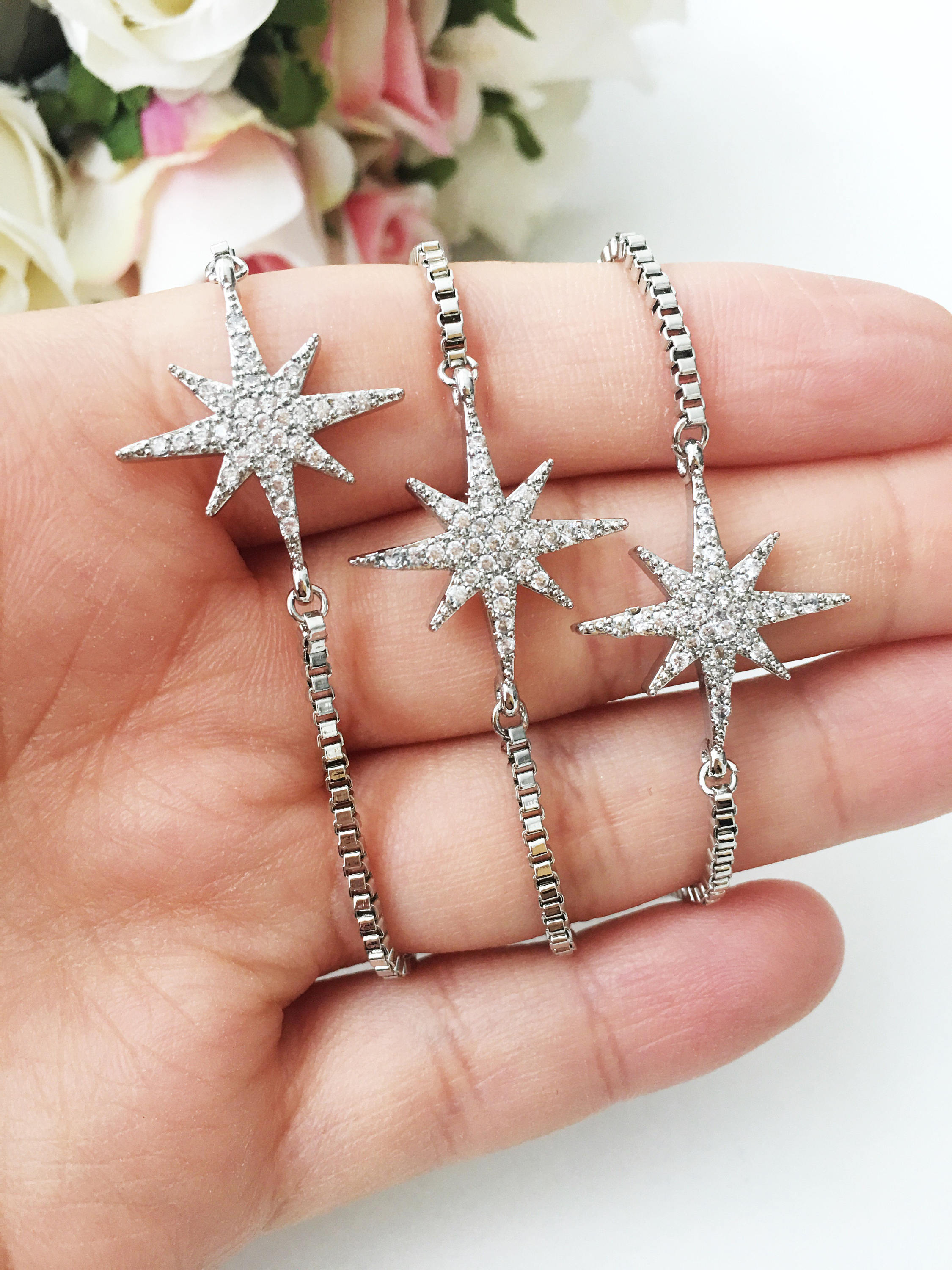 A beautiful handmade silver star bracelet featuring a silver star charm, adjustable design, and tarnish-resistant stainless steel material.