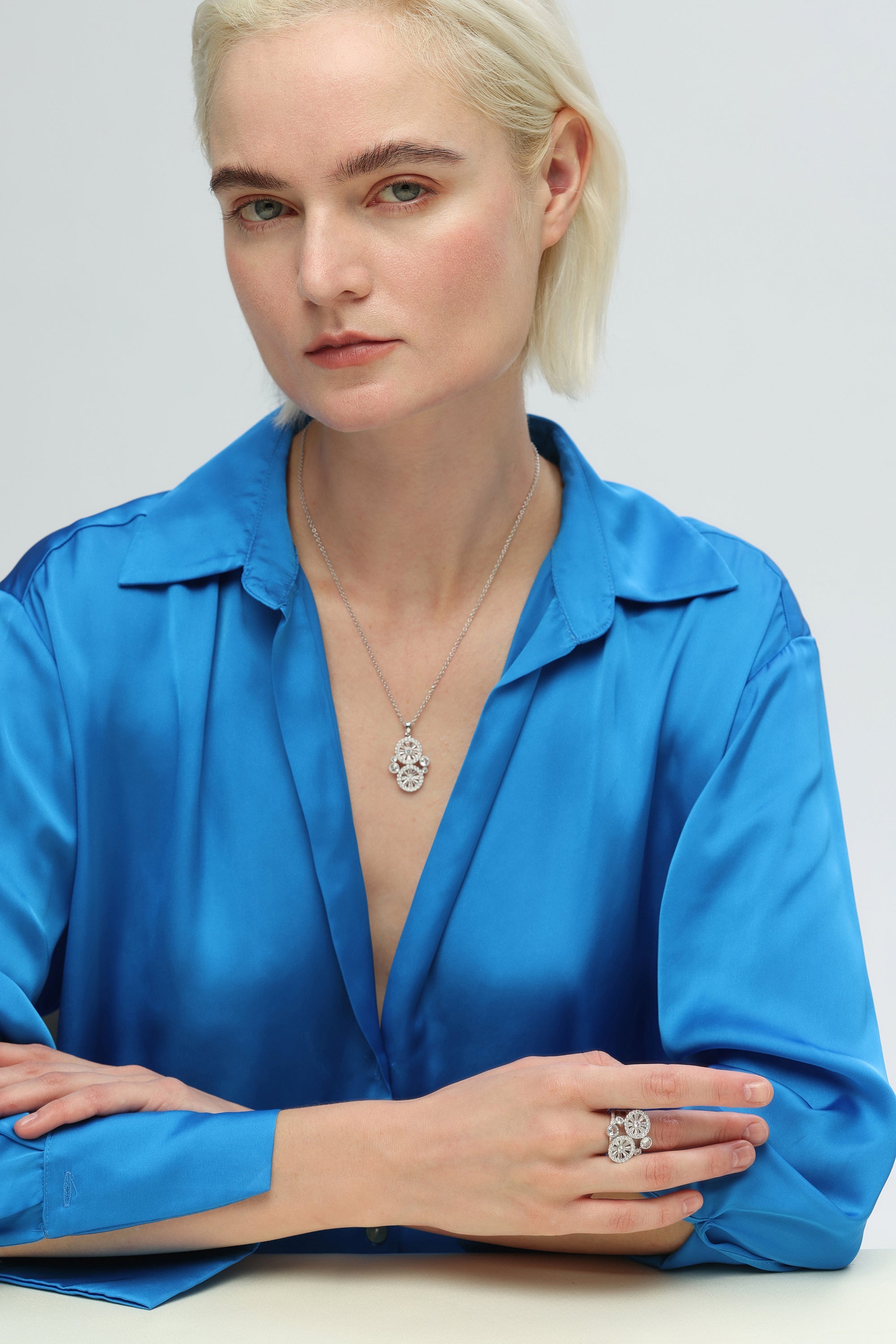 A stunning Silver Wheel of Fortune Signet Ring featuring a unique wheel design and sparkling cubic zirconia.