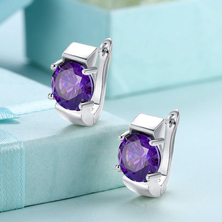 A pair of elegant simulated amethyst metallic leverback earrings set in 18K white gold, showcasing their beautiful design and craftsmanship.