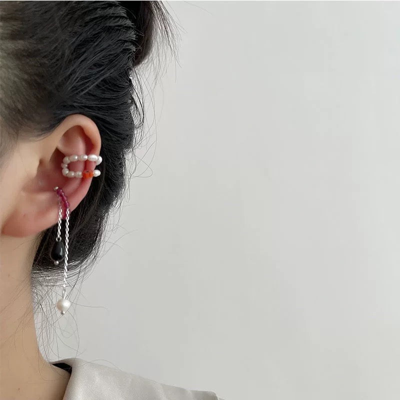 A pair of elegant ear clips featuring single coloured crystals and artificial pearls, crafted from alloy, showcasing a stylish design.