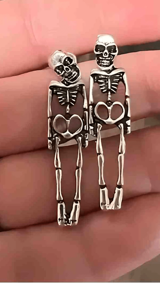 A pair of Skeleton Stud Dangle Earrings featuring intricate skeleton designs with a silver finish, perfect for adding a gothic touch to any outfit.