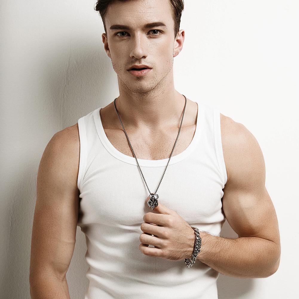 A stylish Skull Chain Bracelet made of 316L surgical stainless steel with 14K gold PVD plating, showcasing intricate skull designs.