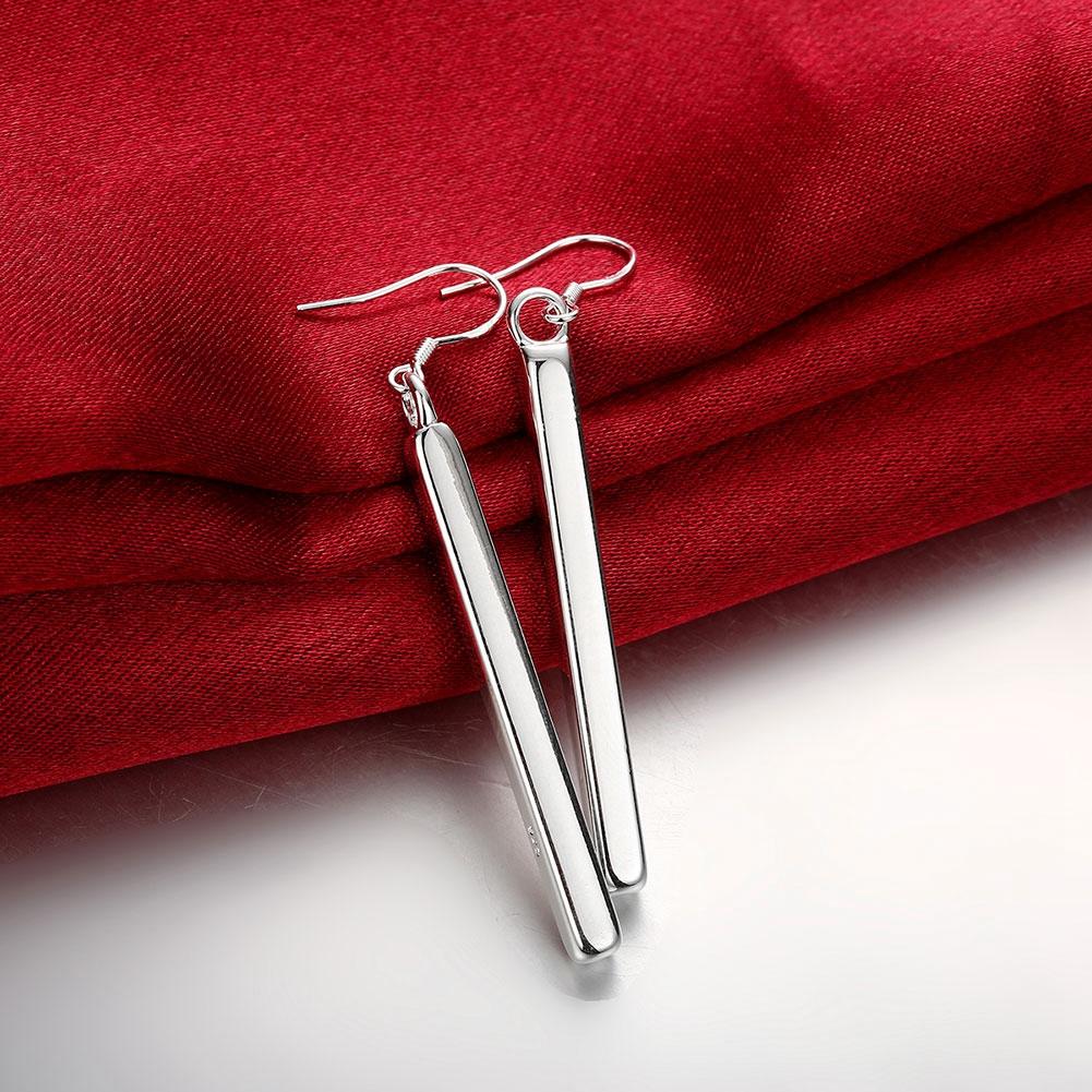 Sleek vertical drop bar earrings in sterling silver plating, showcasing a minimalist design and elegant finish.