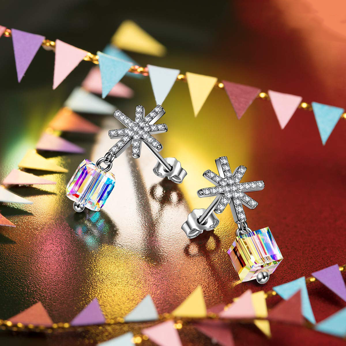 Elegant Snowflake Flaming Phoenix Cubed Drop Earrings made of brass with rhodium plating and cubic zircon stones.