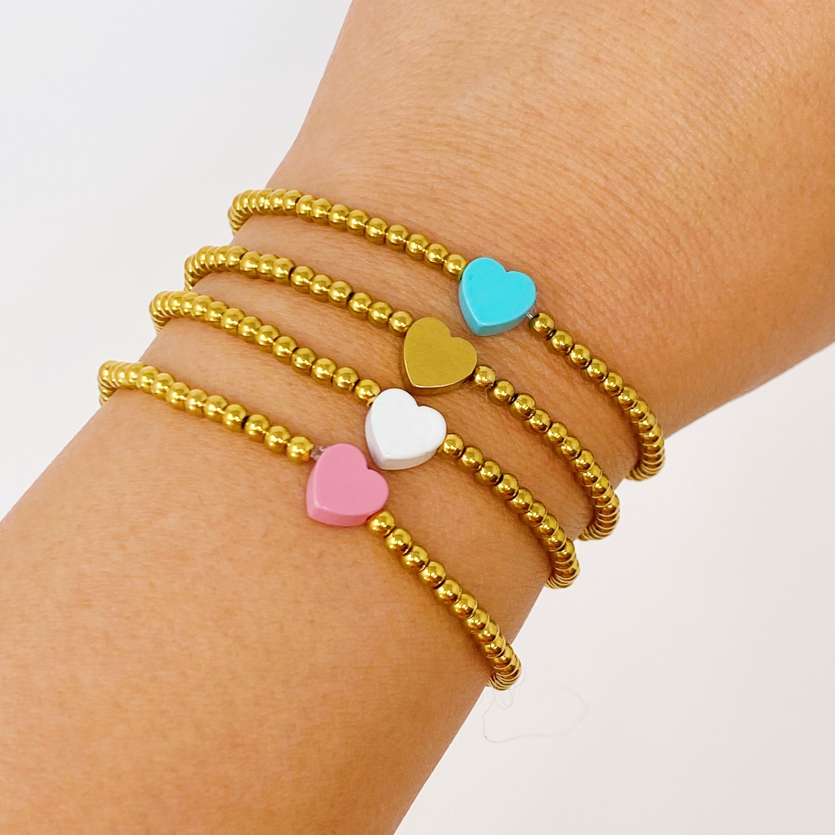 So Very Loved Heart Bracelet featuring colorful enamel hearts and gold plated brass, perfect for gifting and everyday wear.