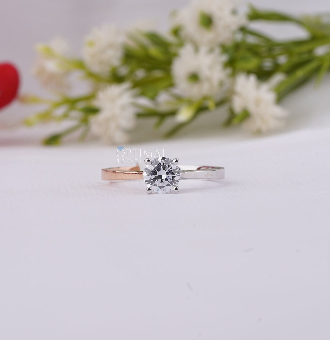 Elegant 0.72 Ctw round cut lab grown diamond solitaire ring in two-tone gold setting, showcasing its brilliance and craftsmanship.
