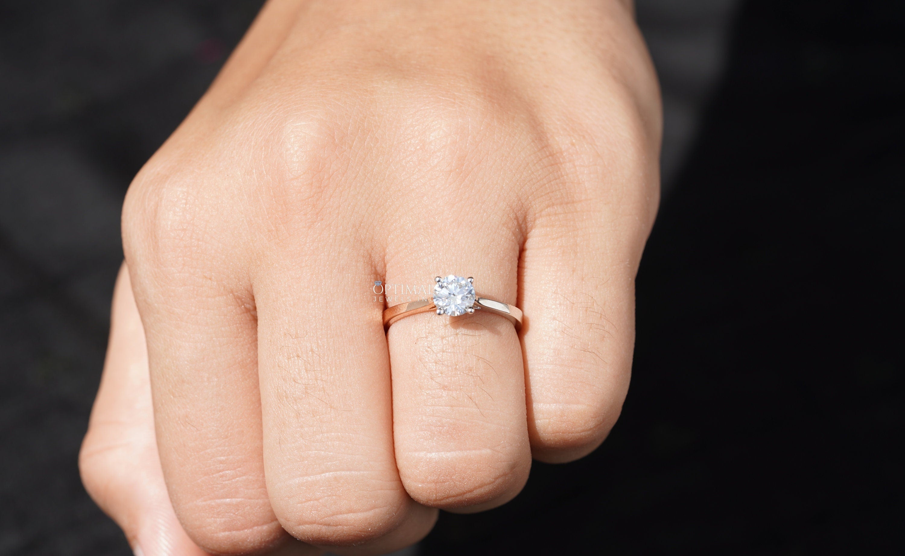 Elegant 0.72 Ctw round cut lab grown diamond solitaire ring in two-tone gold setting, showcasing its brilliance and craftsmanship.