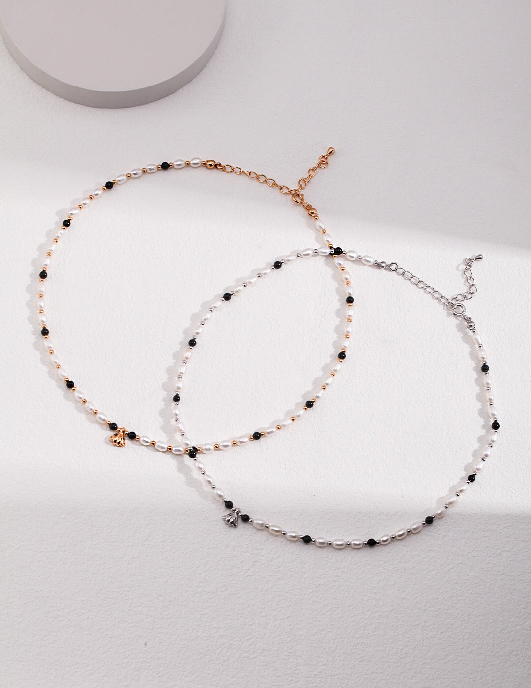 A stunning Spaced Black Onyx Pearl Pendant Necklace featuring natural pearls, black onyx, and gold vermeil accents, elegantly displayed.