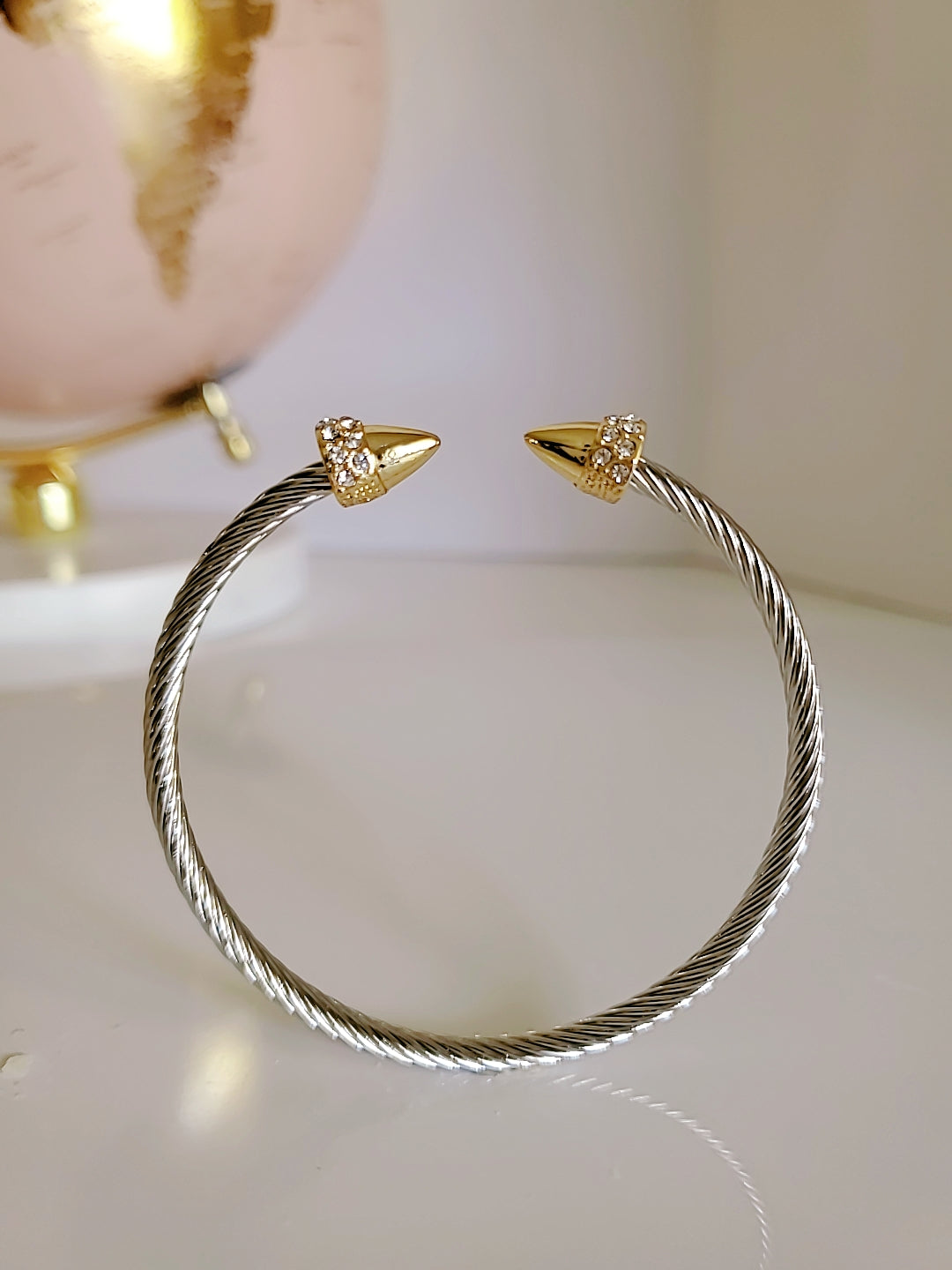 Elegant Spear Bangle Bracelet in 18K gold filled with simulated diamonds, showcasing a unique spear design.