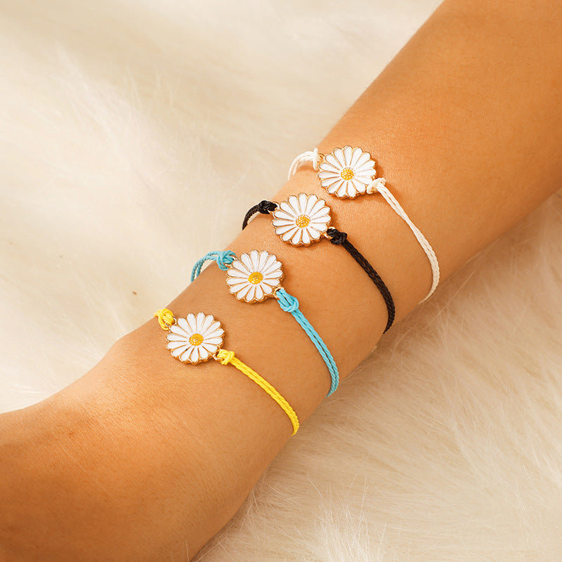 A vibrant Spring Time Multi-Daisies Floral Bracelet featuring colorful daisies on a stretchable brass chain, perfect for all wrist sizes.