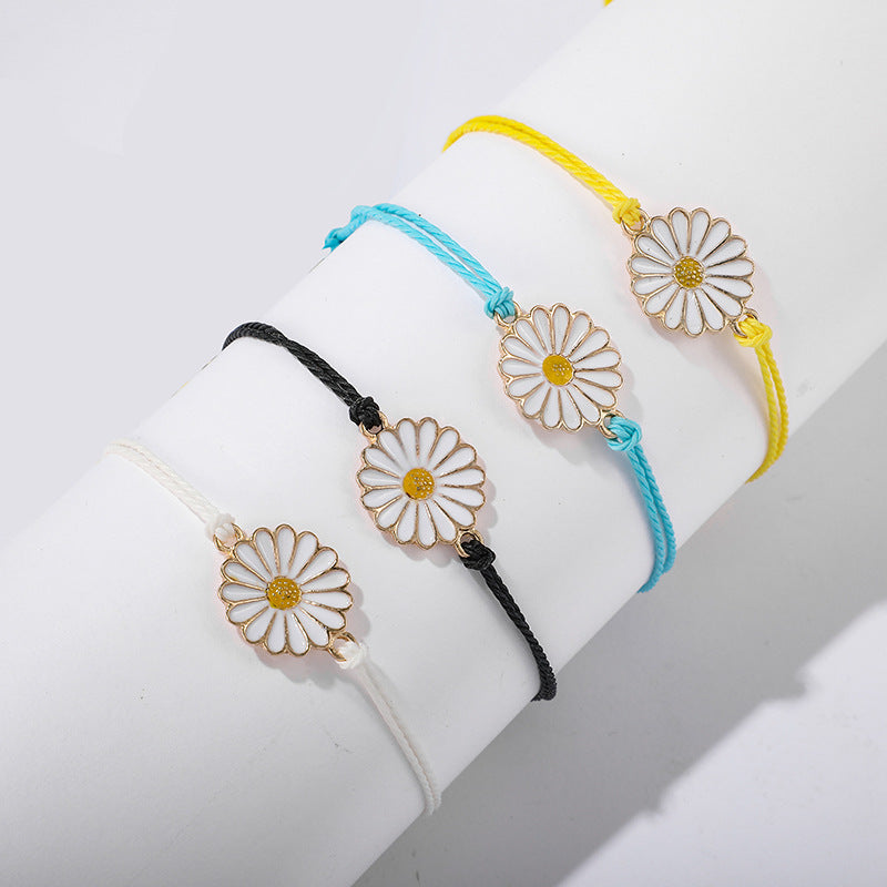 A vibrant Spring Time Multi-Daisies Floral Bracelet featuring colorful daisies on a stretchable brass chain, perfect for all wrist sizes.