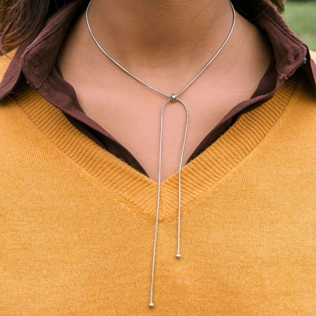 Stainless Silver Bow Knot Sliding Bead Snake Chain Choker, adjustable length, featuring a minimalistic design and crafted from 925 sterling silver.