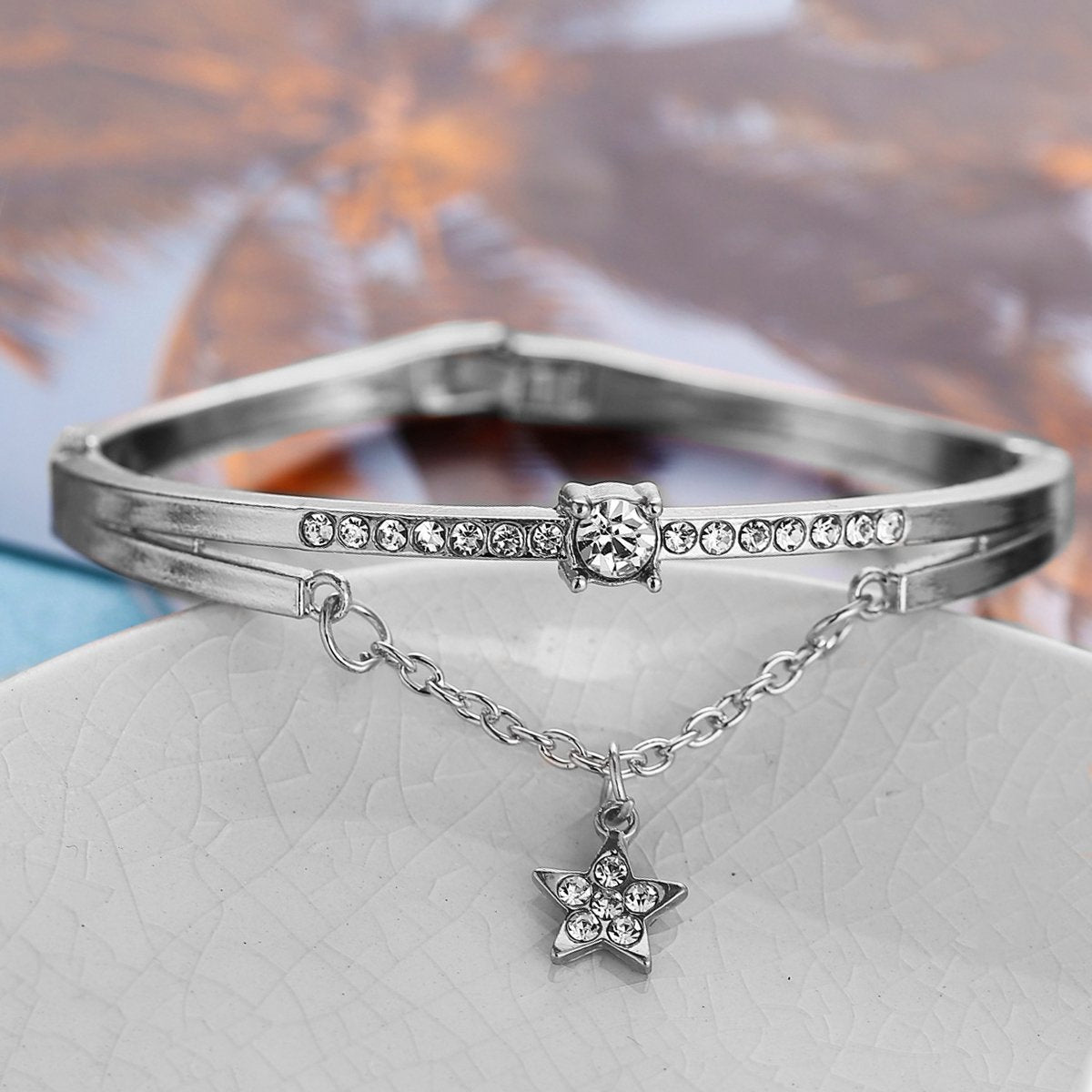 Elegant Star Drop Bracelet featuring Austrian Crystals, crafted in 18K white gold plating, showcasing a stunning design.