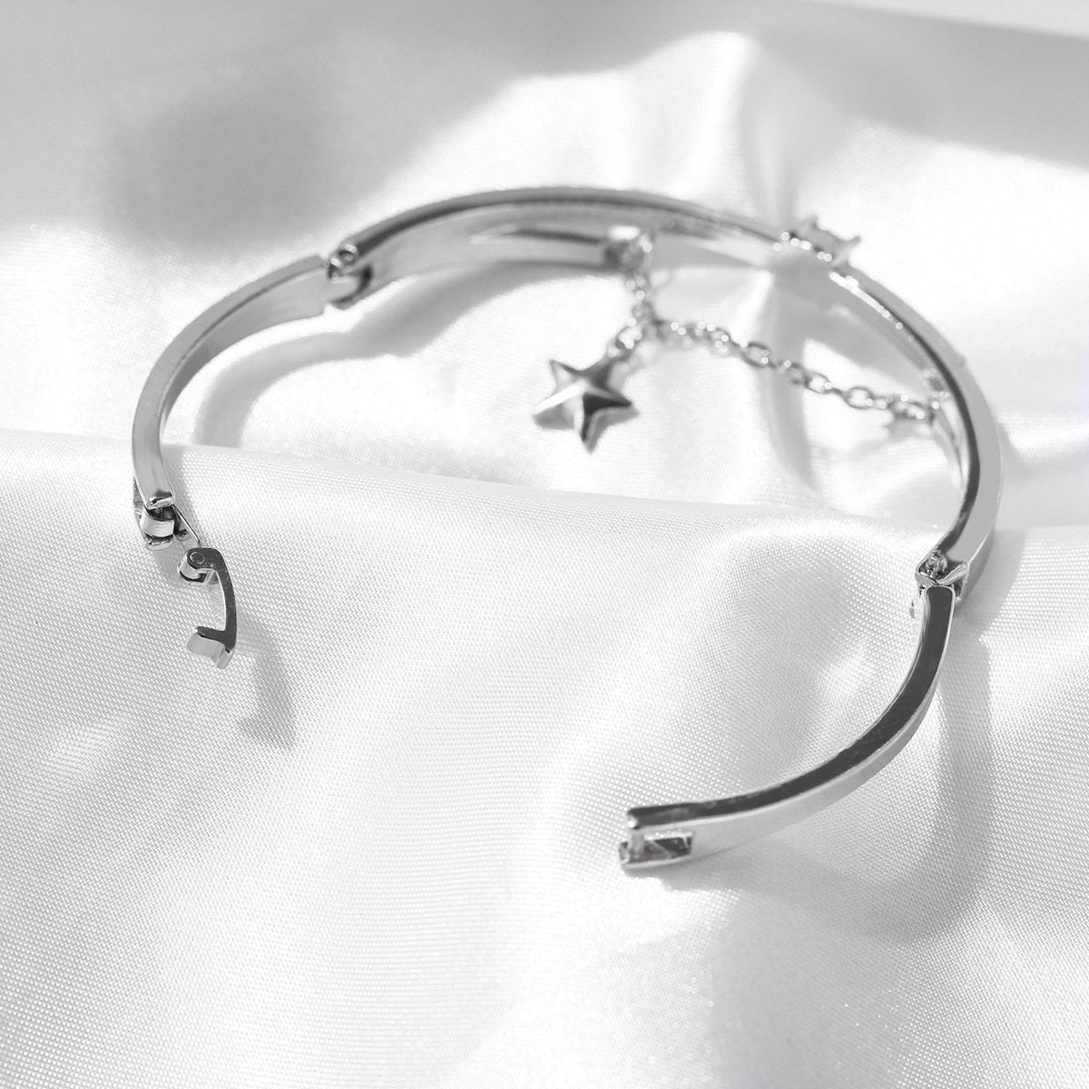 Elegant Star Drop Bracelet featuring Austrian Crystals, crafted in 18K white gold plating, showcasing a stunning design.