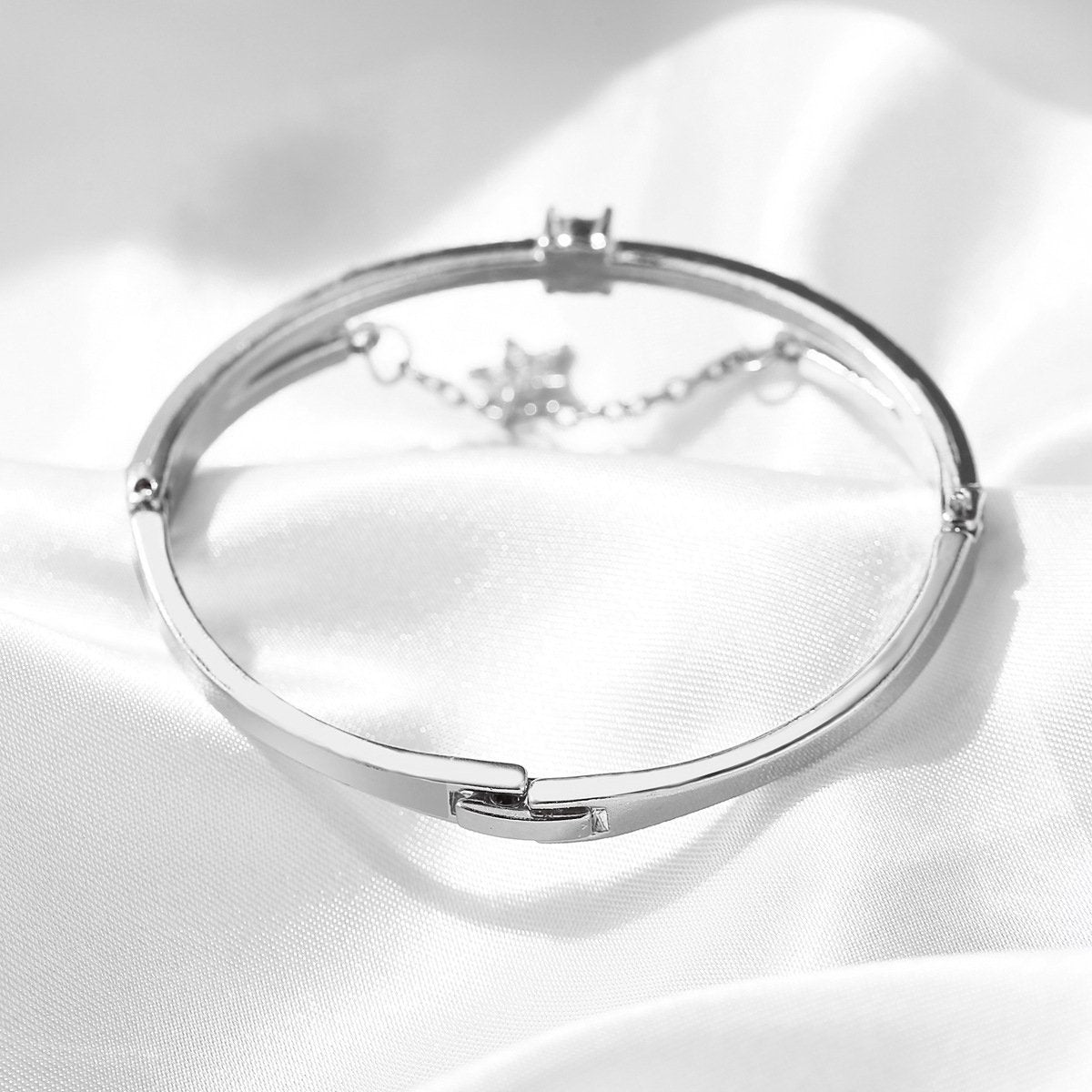 Elegant Star Drop Bracelet featuring Austrian Crystals, crafted in 18K white gold plating, showcasing a stunning design.