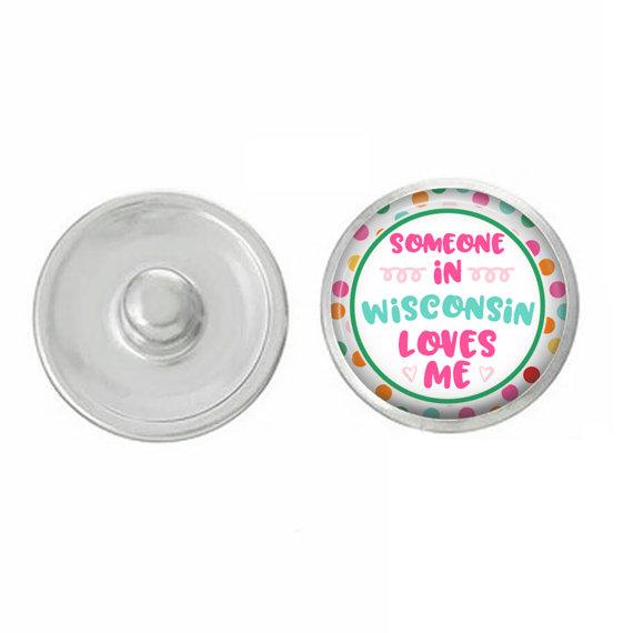 A colorful set of five hand-pressed state-themed snaps, showcasing various state designs, perfect for customizing jewelry.